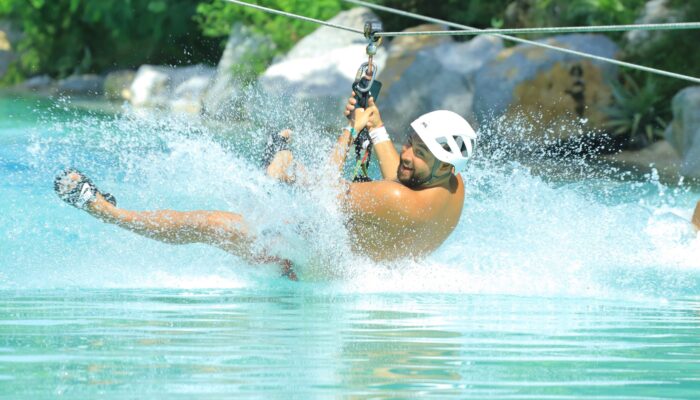 Adventure-filled Scape Park in Punta Cana, showcasing lush tropical landscapes, zip lines, underground caves, and natural cenotes for visitors to explore and enjoy