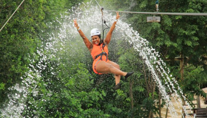 Adventure-filled Scape Park in Punta Cana, showcasing lush tropical landscapes, zip lines, underground caves, and natural cenotes for visitors to explore and enjoy