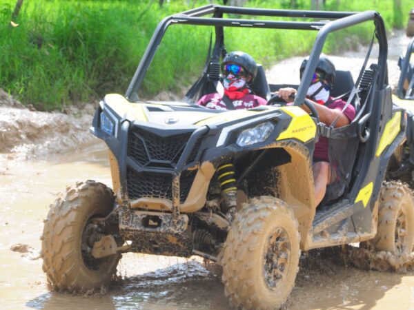 Couple on a thrilling half-day buggy adventure in Punta Cana with Can-Am and Honda 700cc vehicles