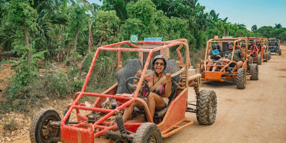 Thrilling buggy ride through the countryside, with participants navigating rugged trails and scenic landscapes in off-road vehicles, experiencing the natural beauty and adventure of rural terrain.