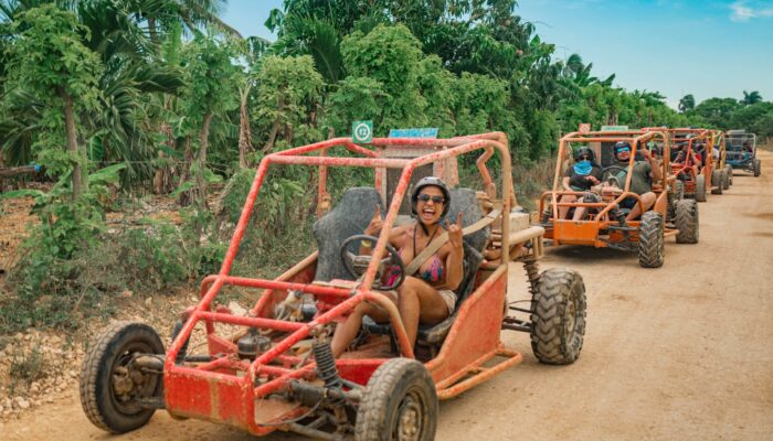 Thrilling buggy ride through the countryside, with participants navigating rugged trails and scenic landscapes in off-road vehicles, experiencing the natural beauty and adventure of rural terrain.