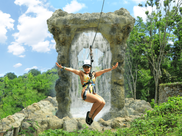 Adventure-filled Scape Park in Punta Cana, showcasing lush tropical landscapes, zip lines, underground caves, and natural cenotes for visitors to explore and enjoy