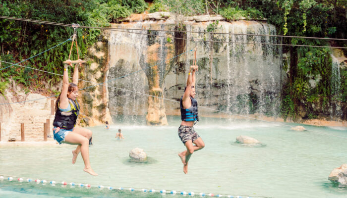 Adventure-filled Scape Park in Punta Cana, showcasing lush tropical landscapes, zip lines, underground caves, and natural cenotes for visitors to explore and enjoy