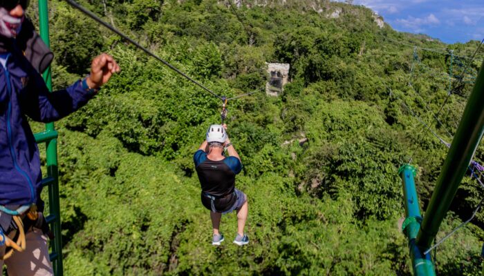 Adventure-filled Scape Park in Punta Cana, showcasing lush tropical landscapes, zip lines, underground caves, and natural cenotes for visitors to explore and enjoy