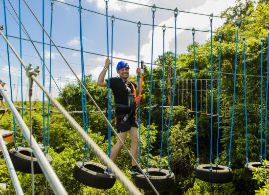 Adventure-filled Scape Park in Punta Cana, showcasing lush tropical landscapes, zip lines, underground caves, and natural cenotes for visitors to explore and enjoy