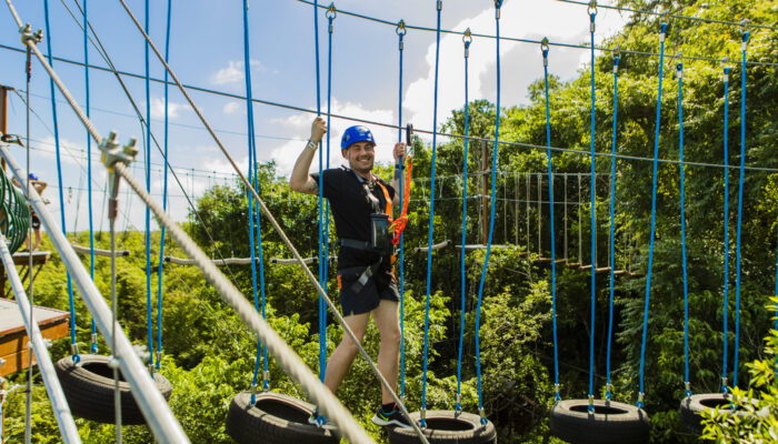 Adventure-filled Scape Park in Punta Cana, showcasing lush tropical landscapes, zip lines, underground caves, and natural cenotes for visitors to explore and enjoy