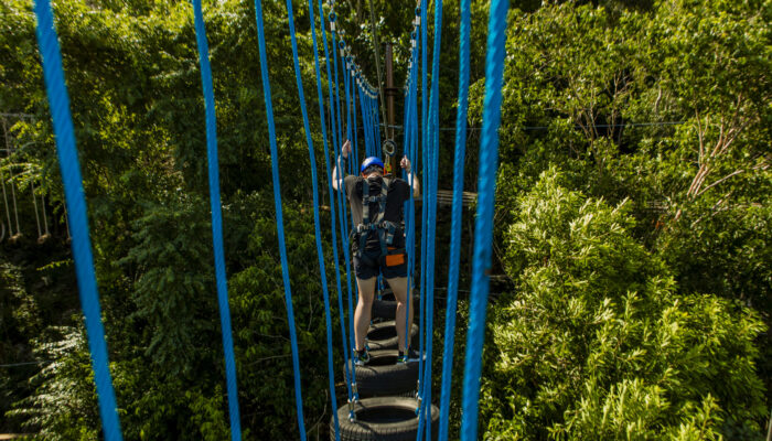 Adventure-filled Scape Park in Punta Cana, showcasing lush tropical landscapes, zip lines, underground caves, and natural cenotes for visitors to explore and enjoy