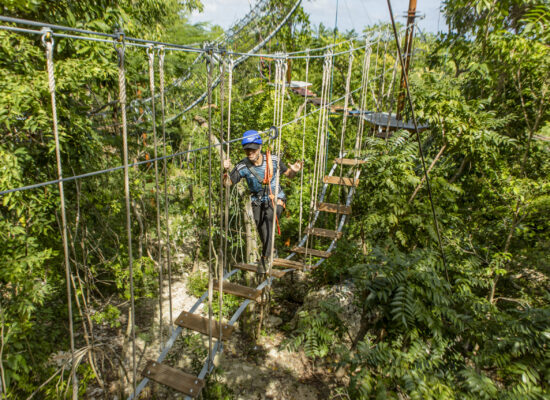 Adventure-filled Scape Park in Punta Cana, showcasing lush tropical landscapes, zip lines, underground caves, and natural cenotes for visitors to explore and enjoy