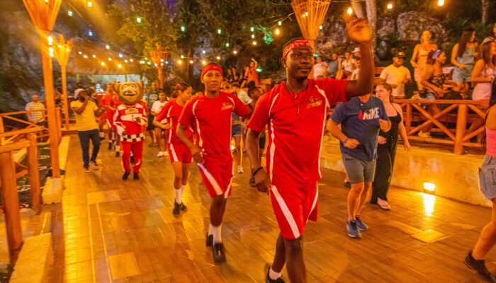 Colorful Carnival Show featuring lively dancers in extravagant costumes, vibrant masks, and rhythmic music, celebrating the festive spirit and cultural heritage of the Caribbean.