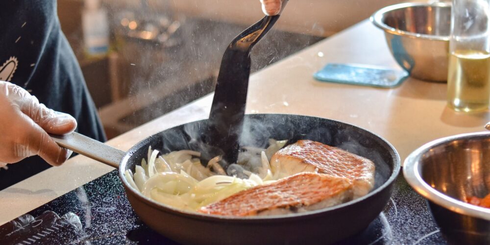 Chef-led class on Cooking Red Snapper in Coconut Milk, featuring fresh preparation techniques, seasoning tips, and step-by-step instructions for creating a delicious seafood dish.