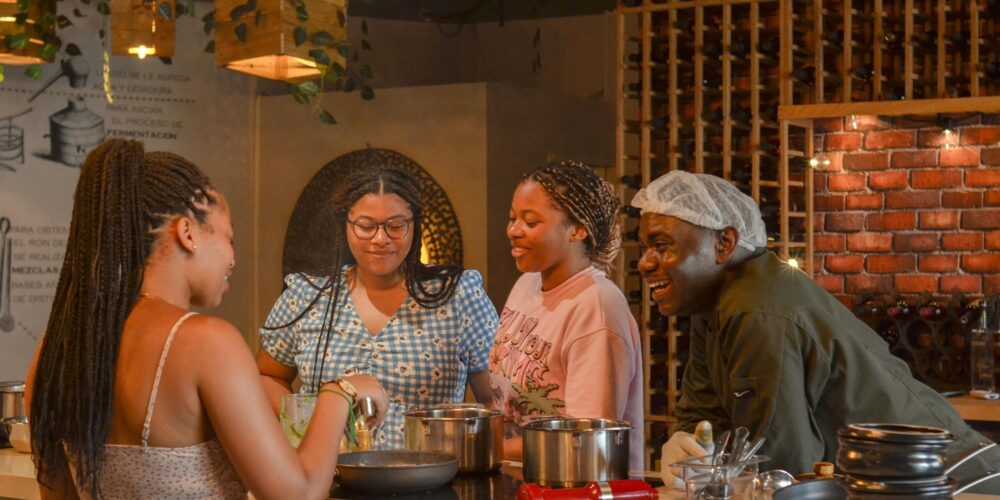 Traditional Sancocho Cooking Master Class, guiding participants through the process of preparing the Dominican Republic's signature stew with a blend of meats, root vegetables, and spices.