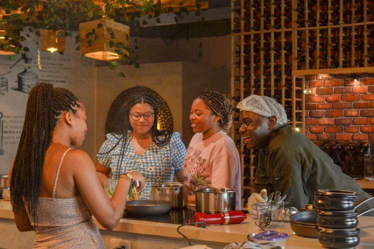 Traditional Sancocho Cooking Master Class, guiding participants through the process of preparing the Dominican Republic's signature stew with a blend of meats, root vegetables, and spices.