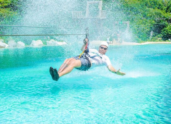 Adventure-filled Scape Park in Punta Cana, showcasing lush tropical landscapes, zip lines, underground caves, and natural cenotes for visitors to explore and enjoy